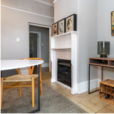 dining table in front of fireplace